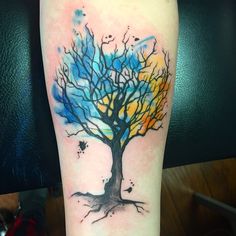 a tattoo with a tree on it