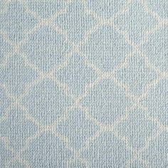 an upholstered blue and white fabric with small squares