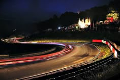 a long exposure shot of a highway at night