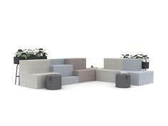 several planters with plants in them are arranged on concrete blocks and placed next to each other