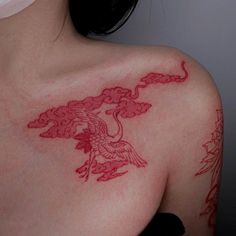 a woman with a tattoo on her shoulder