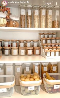 an organized pantry filled with lots of food and storage bins on the shelves in front of each other