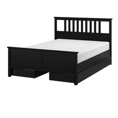 a black bed with two drawers underneath it