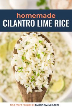 a wooden spoon filled with rice and garnished with cilantro limes