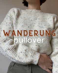 a woman wearing a white sweater with the words wanderung pullover on it's chest