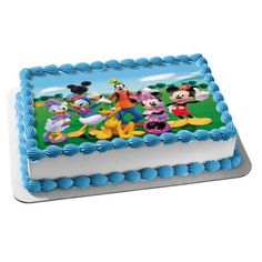 a birthday cake with mickey mouse characters on it