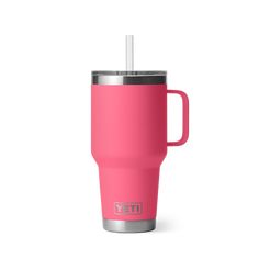 the yeti travel mug is pink with a stainless steel lid and straw in it