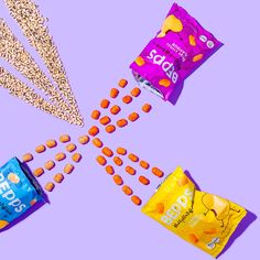 some snacks and candy on a purple background