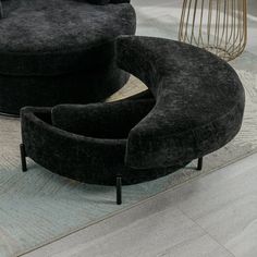 two black chairs sitting on top of a rug