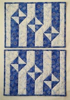 two blue and white quilts with arrows on them