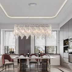 a dining room table with chairs and a chandelier hanging from it's ceiling