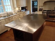 a large stainless steel counter top in a kitchen