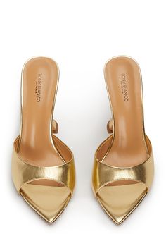 Pointed perfection, the Marcel gold leather mules are designed with a sleek and paired back shape and feature an open pointed toe-shape, a low cut rounded vamp and a chic hourglass shaped heel. With a quality luxe leather upper, lining and cushioned sole this style is not to be missed. -Material: Leather Upper & Lining -Sole: Man-Made -Fit: True to size -Toe-shape: Pointed -Features: Hourglass shaped heel -Heel: 10.5cm Metallic Kitten Heels, Gold Low Heels, Tony Bianco Heels, Metallic Gold Shoes, Gold Kitten Heels, Gold Mules, Thigh High Boots Flat, Ball Ideas, Unique Heels