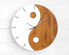 a clock made out of wood and white paint