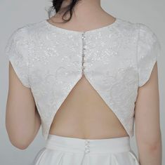 "The elegant and classy \"Aiko\" crop top features sparkly sequined lace mounted onto a matte ivory bridal satin, and it has wide fit cap sleeves, open triangle back and clear buttons. It is only available in shown ivory color. We recommend wearing backless bra with this top. Pair this top with any or our bridal bottoms: https://www.etsy.com/shop/WardrobeByDulcinea?ref=l2-shop-info-name%C2%A7ion_id&section_id=19306135 We would be needing these measurements from you and here are the instructi Bridal Crop Top, Two Piece Wedding Dress, Bridal Tops, Backless Bra, Sequin Crop Top, Ivory Bridal, Wedding Top, Bridal Wedding, Elegant Wedding