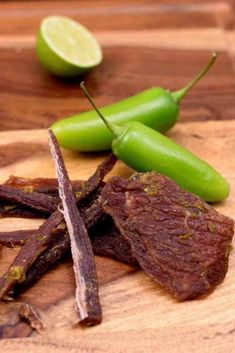 green peppers and beef on a cutting board