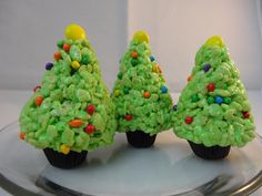 three cupcakes shaped like christmas trees on a plate