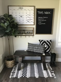 a black and white checkered area rug on the floor next to a coffee table