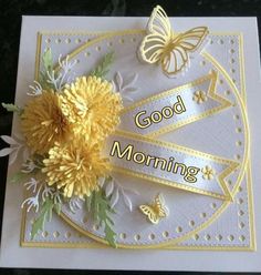 a card with yellow flowers and butterflies on it, good morning written in the middle