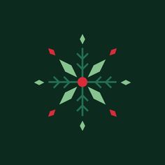 a green and red snowflake on a black background