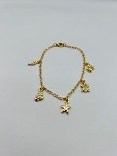 This quirky and alternative handmade gold charm bracelet, made with 24k gold plated ocean charms, is the perfect summer accessory.  Designed and handmade in Scotland, UK, using 24k gold plated quality charms, chain and fastenings, which are lead and nickel free.  This bracelet is available as 7", 7.5" or 8", but I will happily offer longer lengths, if needed. Please contact me direct for this.  The bracelet doesn't include an extender but this can be added, for an additional cost, here:  https:/ Christmas Bridesmaids, Bracelet Ocean, Charm Bracelet Gold, Birthday Vibes, Handmade Charm Bracelets, Custom Charm Bracelet, Scotland Uk, Haircut Inspiration, Perfume Making