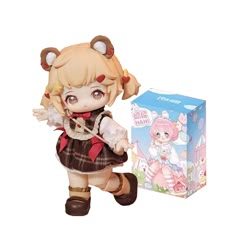 an anime doll next to a box