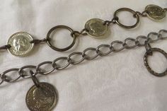 Vintage Metal BELT with Faux U.S. COINS.  1960's or 1970's Era Ladies Belt.   Length is 74"  The coins are 1" in diameter  the large ring/links in the belt are 1 1/4"  CONDITION:  Shows some age/wear/use.  Some of the gold tone has rubbed off.  Vintage/used item. Vintage Chain Belt, Adjustable Vintage Chain Belt, Adjustable Silver Vintage Chain Belt, Vintage Bronze Belt With Antique Buckle, Vintage Adjustable Metal Belt, Mid Century Accessories, 70s Era, Chain Loop, Metal Belt