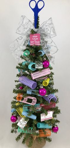 a small christmas tree with scissors and hair clips