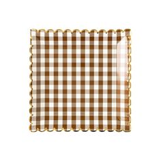 a brown and white checkered napkin with gold trim