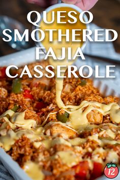 a casserole dish with cheese being drizzled over it and the words queso smothered fajaa casserole