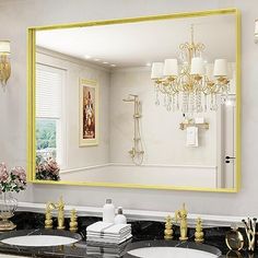 a bathroom with two sinks and a large mirror in it's center area,