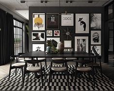 a black and white dining room with pictures on the wall