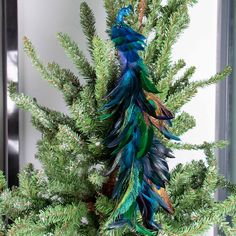 PRICES MAY VARY. Quality Material: Our artificial peacock decoration is made of natural feathers and foam, bright in color and soft to the touch, very like a real peacock. Size: This simulated peacock ornament is 45x7x7cm/17.7x2.8x2.8 inches. There is a metal clip under each artificial peacock bird, which is firmly attached and can be clipped anywhere at will. Realistic Design: This blue peacock decor with long artificial feathers, smart eyes and shiny body. The shape is cute and realistic, very Flocked Christmas Tree Teal, Peacock Angel Tree Topper, Cooper And Dark Teal Christmas Tree, Fabric Names Listdoy Peacock Feathers Christmas Bulb, Peacock Feather Christmas Tree Topper, White Peakock For Christmas Tree, Teal Tree Topper, Mardigra Colors Christmas Tree, Mardi Gras Theme Christmas Tree