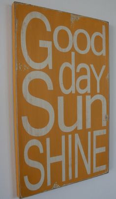 an orange and white sign that says good day sunshine shine