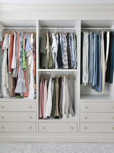 a white closet filled with lots of clothes