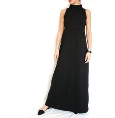 "This sleeveless black A-lined elegant maxi dress with a high collar (turtleneck collar) is minimalist, unique and trendy. It is cut under the chest, fitted on top and loose under the bust, so it looks great on all types of figures. Very elegant and flattering fitting. Details: Care: turn the garment inside out for better washing results, machine wash cold, tumble dry low, warm iron if needed Fabric: A medium/ heavier weight viscose jersey lycra blend Size: You may choose one of 7 standard sizes Long Jersey Dress, Dress Elegant Long, Elegant Maxi Dress, Dress Elegant, Dress Clothes For Women, Jersey Dress, High Collar, Elegant Dresses, One Shoulder Formal Dress