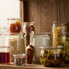 many jars filled with different types of food