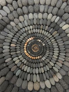 a spiral design made out of rocks and pebbles