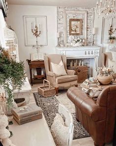 a living room filled with furniture and a fire place under a chandelier in front of a fireplace