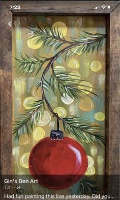 a painting of a christmas ornament hanging from a tree branch with the caption gin's den art