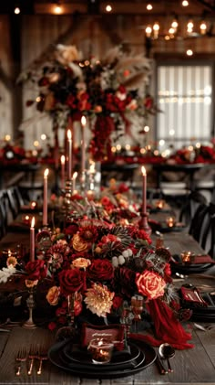 a long table with candles and flowers on it is set up for a formal dinner