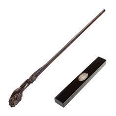 an old fashioned harry potter's wand and its box