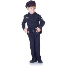 a little boy dressed in police gear standing up with his hands on his hips and looking at the camera