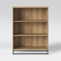 an empty wooden bookcase with metal legs