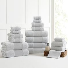 a stack of white towels sitting on top of a table