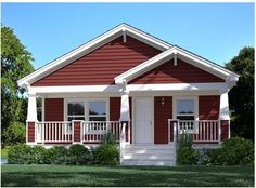 a small red and white house sitting on top of a lush green field