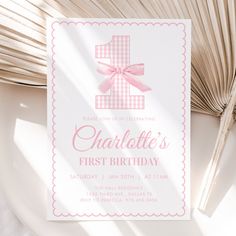 a first birthday party card with a pink bow