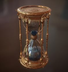 an hourglass with blue sand inside it