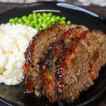 meatloaf, mashed potatoes and peas on a plate