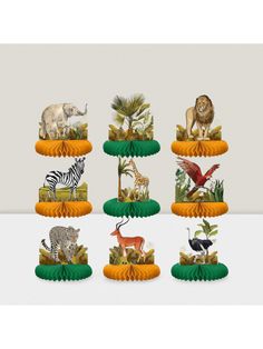 an assortment of animal figurines sitting on top of each other in front of a white background